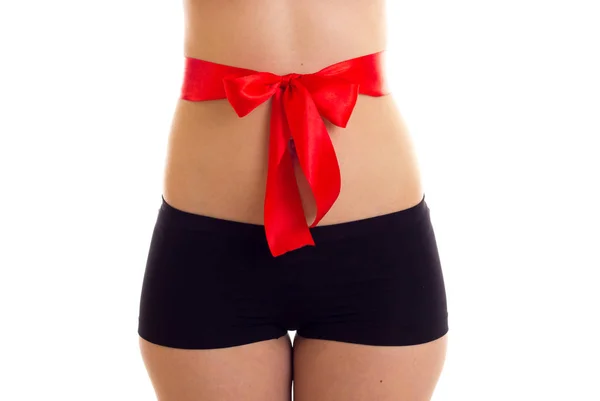 Womans buttocks with red bowtie — Stock Photo, Image