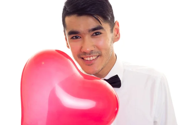 Jovem com laço segurando balão — Fotografia de Stock