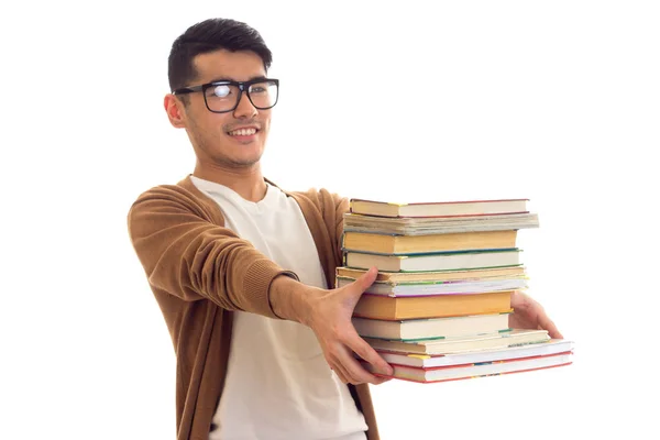 Junger Mann mit Brille und Büchern — Stockfoto