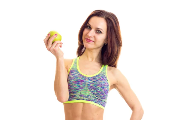 Mujer deportiva sosteniendo manzana —  Fotos de Stock