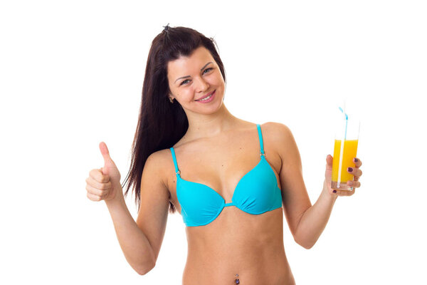 Woman in swimming suit holding cocktail
