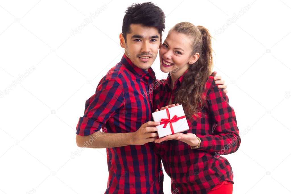 Young couple holding a present