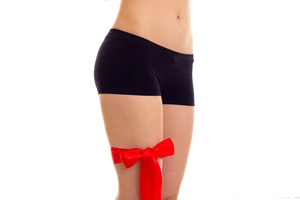 Womans hip with red ribbon — Stock Photo, Image