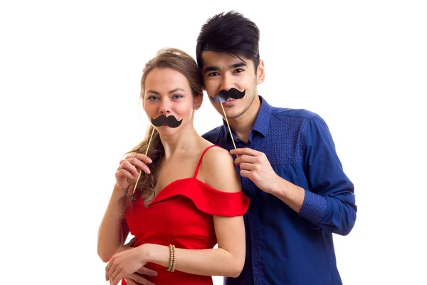 Young couple with cardboard sticks — Stock Photo, Image