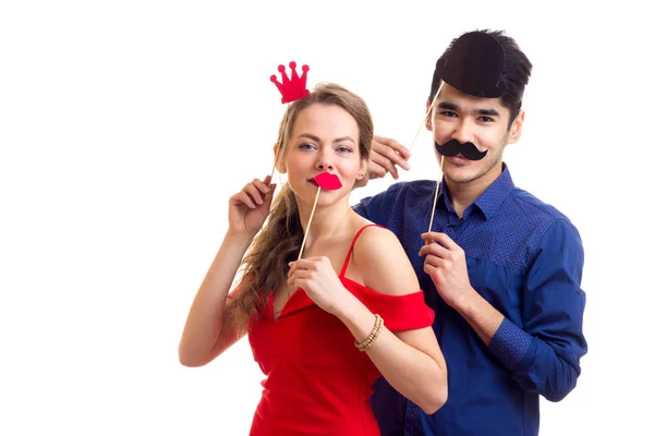 Young couple with cardboard sticks — Stock Photo, Image