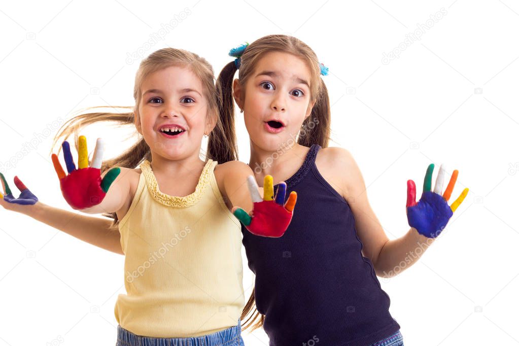 Little girls with colored hands