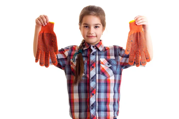 Menina com luvas de laranja — Fotografia de Stock