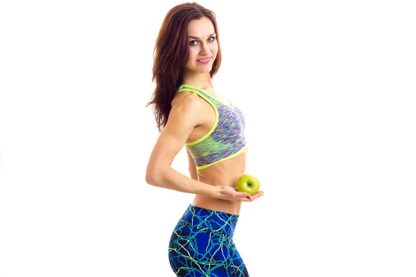 Sportive žena hospodářství jablko — Stock fotografie