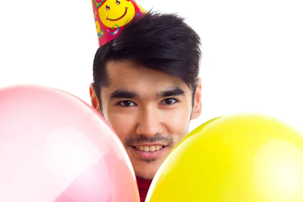 Νεαρός άνδρας εκμετάλλευση μπαλόνια — Φωτογραφία Αρχείου
