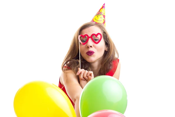 Young woman holding balloons — Stock Photo, Image