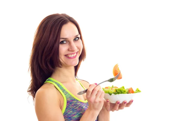 Sportive woman holding salad — Stock Photo, Image