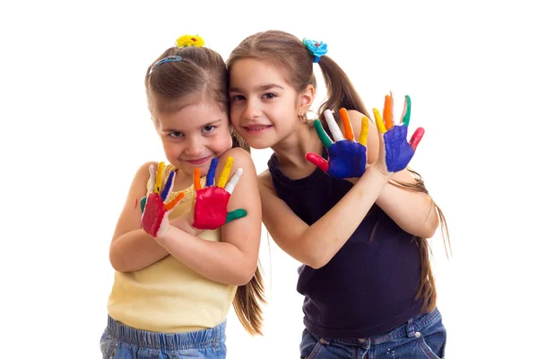 Kleine meisjes met gekleurde handen — Stockfoto