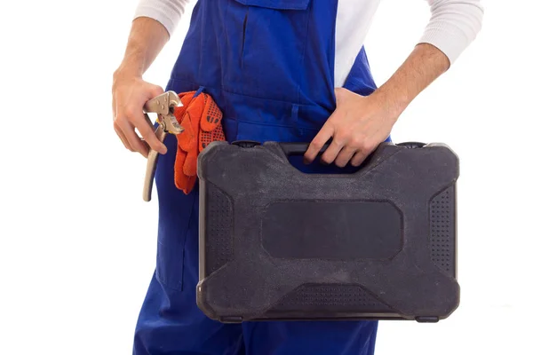 Man in overall holding spanner and toolbox — Stock Photo, Image