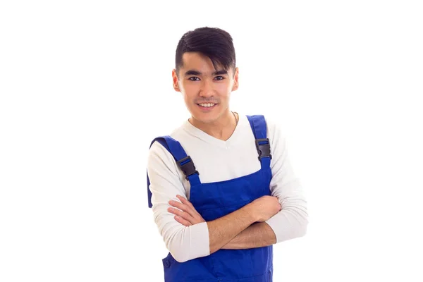 Young man in blue overall — Stock Photo, Image