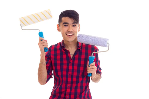 Young man holding two rolls — Stock Photo, Image