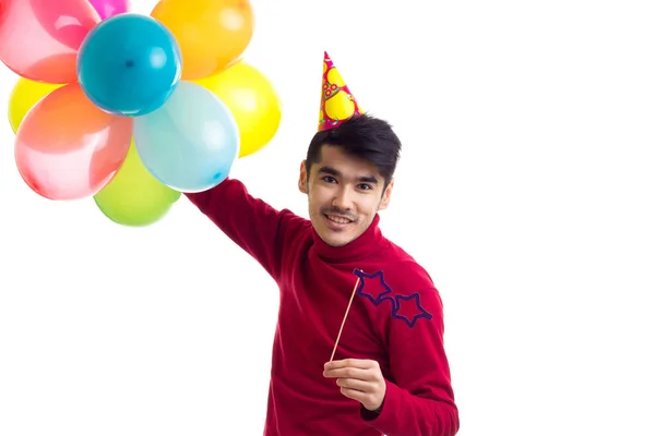 Junger Mann mit Luftballons — Stockfoto