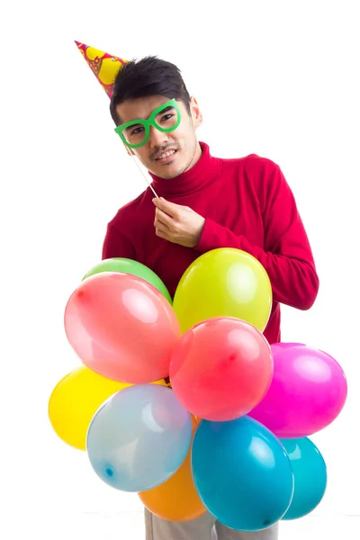 Junger Mann mit Luftballons — Stockfoto