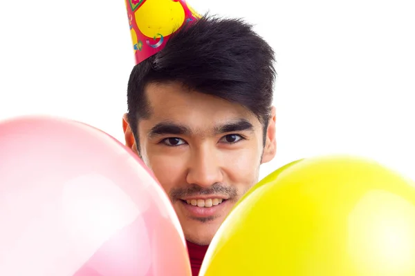 Junger Mann mit Luftballons — Stockfoto