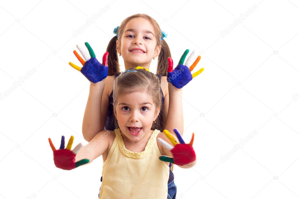 Little girls with colored hands