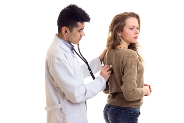 Doctor listening to womans back — Stock Photo, Image