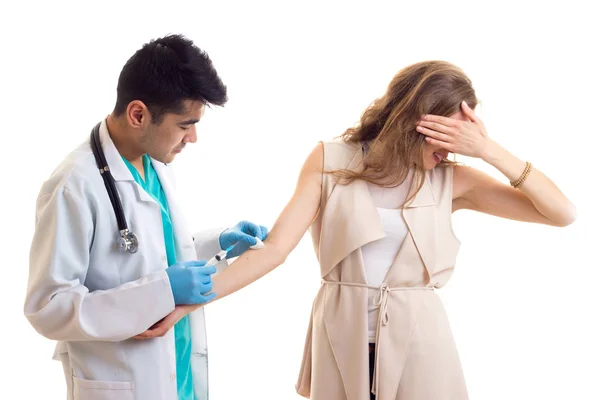 Male octor making injection of young woman — Stock Photo, Image