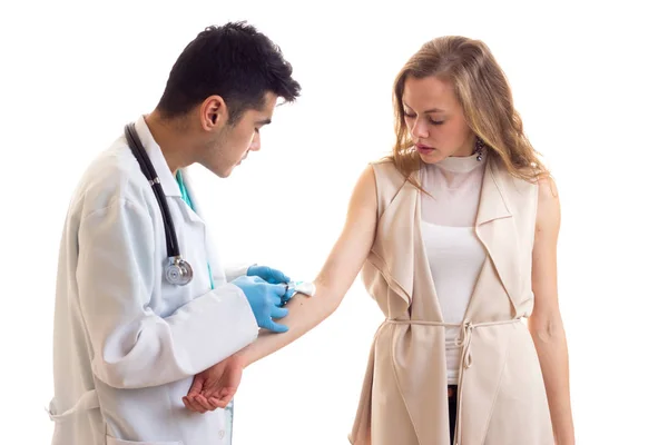 Male octor making injection of young woman — Stock Photo, Image