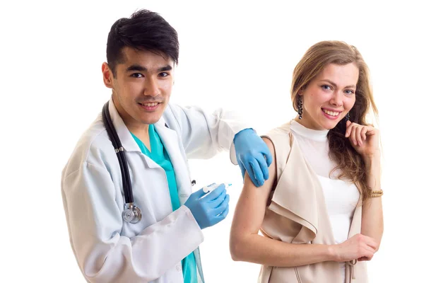 Male octor making injection of young woman — Stock Photo, Image