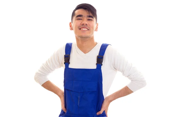 Young man in blue overall — Stock Photo, Image