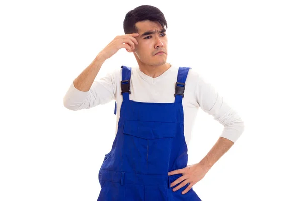 Young sad man in blue overall — Stock Photo, Image