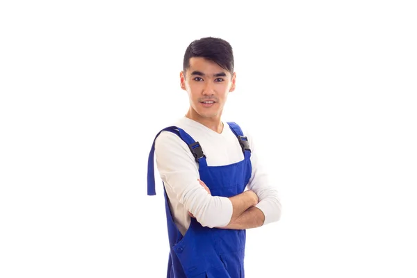 Young man in blue overall — Stock Photo, Image