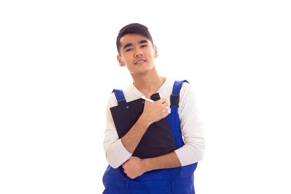 Joven en azul en general la celebración de la pluma y la carpeta —  Fotos de Stock