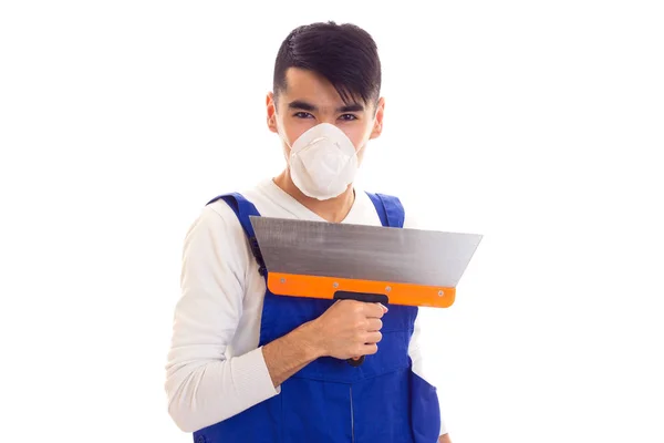 Uomo in blu generale con spatola respiratore — Foto Stock