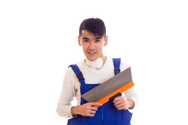 Man in blue overall with respirator holding spatula — Stock Photo, Image