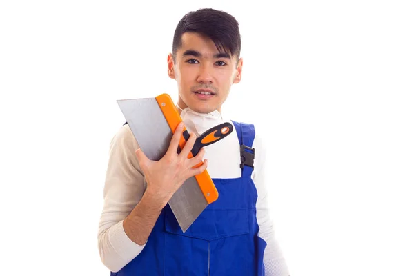 Man in blue overall with respirator holding spatula — Stock Photo, Image