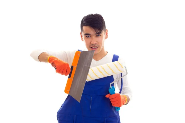 Man in het algemeen met handschoenen holding spatel en roll blauw — Stockfoto