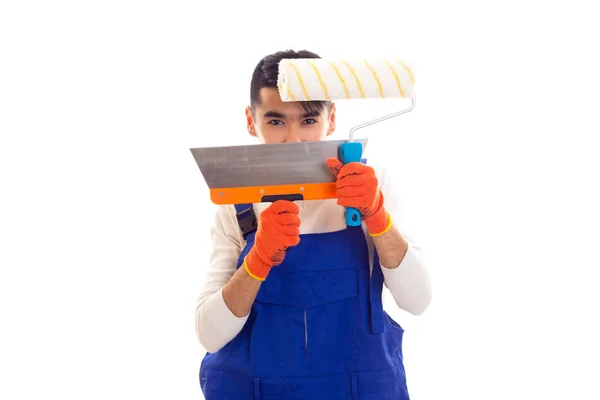 Man in het algemeen met handschoenen holding spatel en roll blauw — Stockfoto