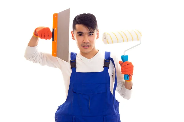 Man in het algemeen met handschoenen holding spatel en roll blauw — Stockfoto