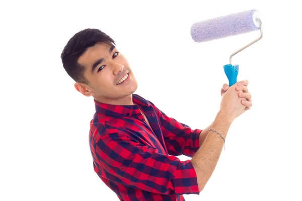 Young man using blue roll — Stock Photo, Image