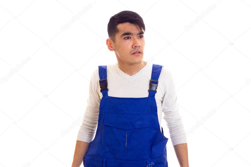Young man in blue overall