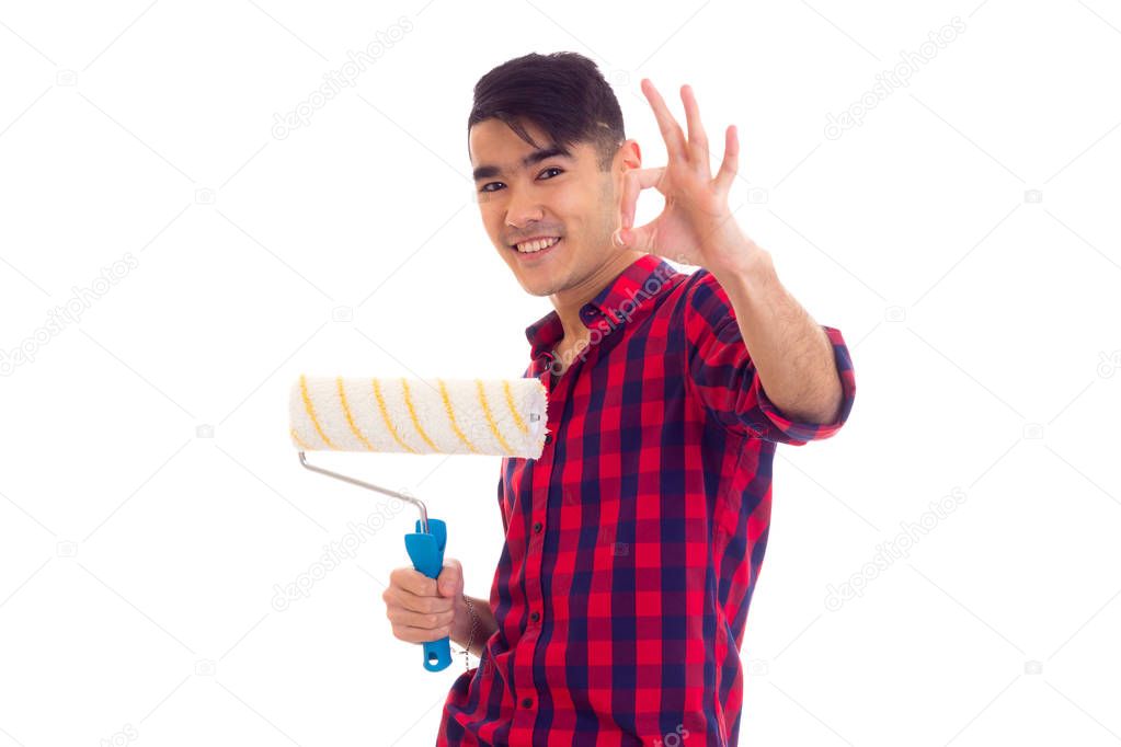 Young man holding a roll