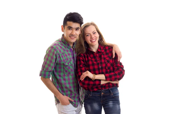 Jovem casal em camisas xadrez — Fotografia de Stock