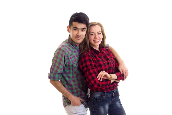 Jovem casal em camisas xadrez — Fotografia de Stock