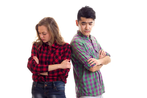 Pareja joven en camisas a cuadros — Foto de Stock