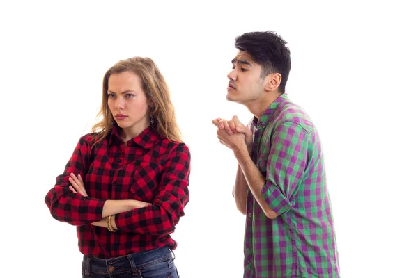 Young couple in plaid shirts arguing — Stock Photo, Image