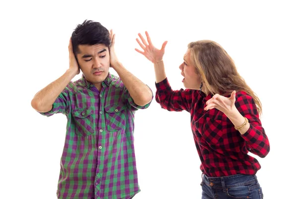 Young couple in plaid shirts arguing — Stock Photo, Image