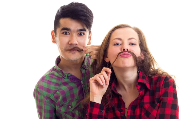 Jeune couple en chemises à carreaux avec moustache de cheveux — Photo