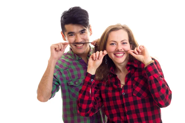 Jeune couple en chemises à carreaux avec moustache de cheveux — Photo