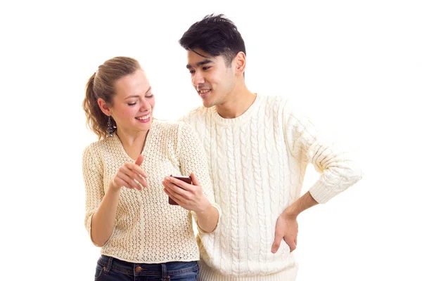 Young couple using smartphone — Stock Photo, Image