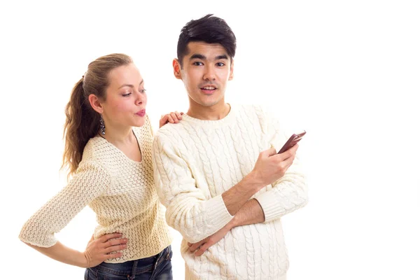 Young couple using smartphone — Stock Photo, Image