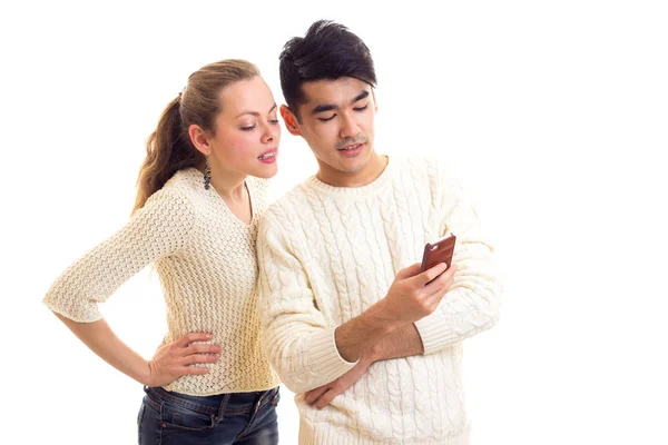 Young couple using smartphone — Stock Photo, Image